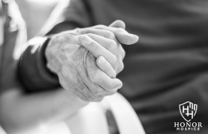 Honor Hospice holding patient hand